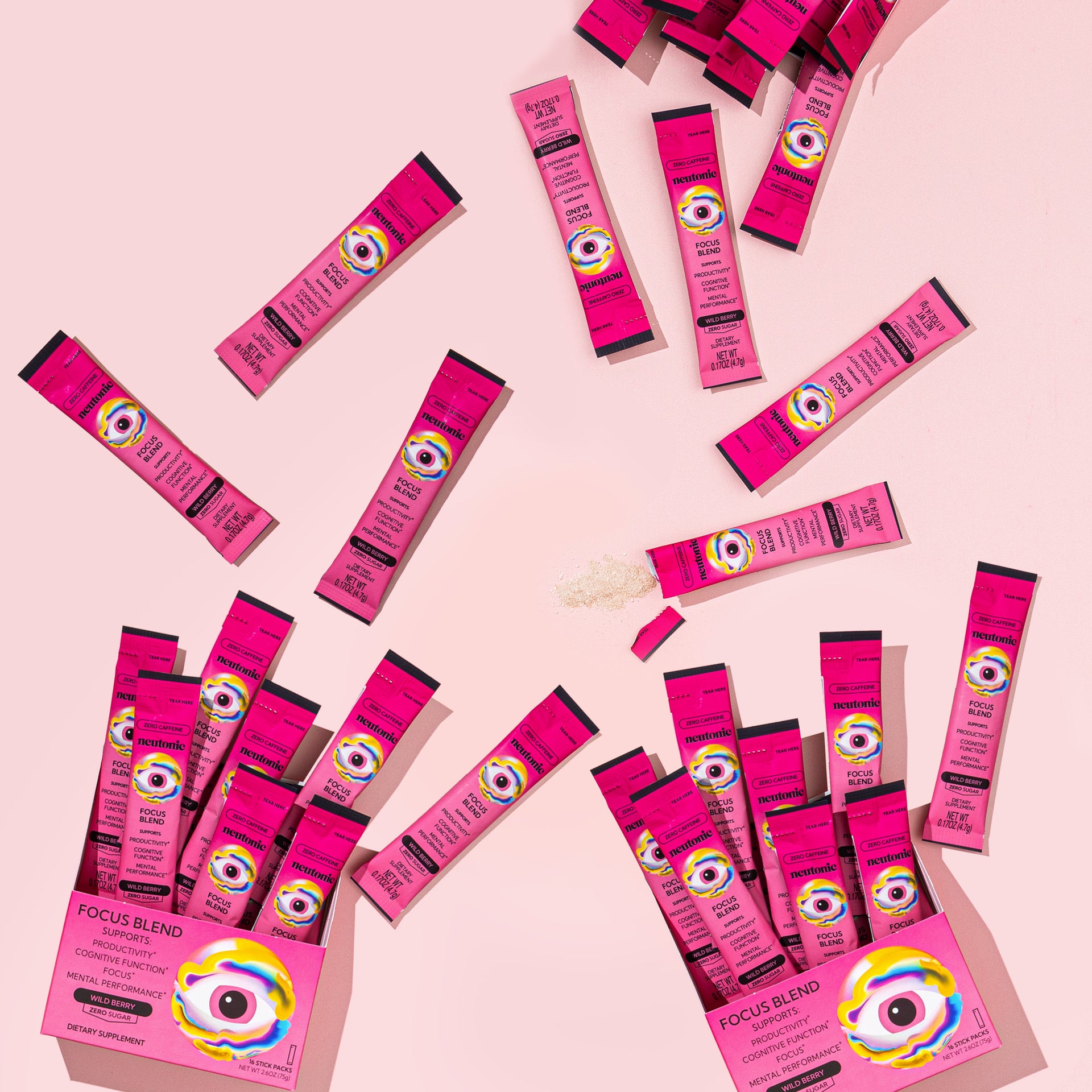 Pink Focus Blend nootropics sticks arranged on pink background with open box displaying packaging design. - Neutonic - Focus Blend - 32 Sticks