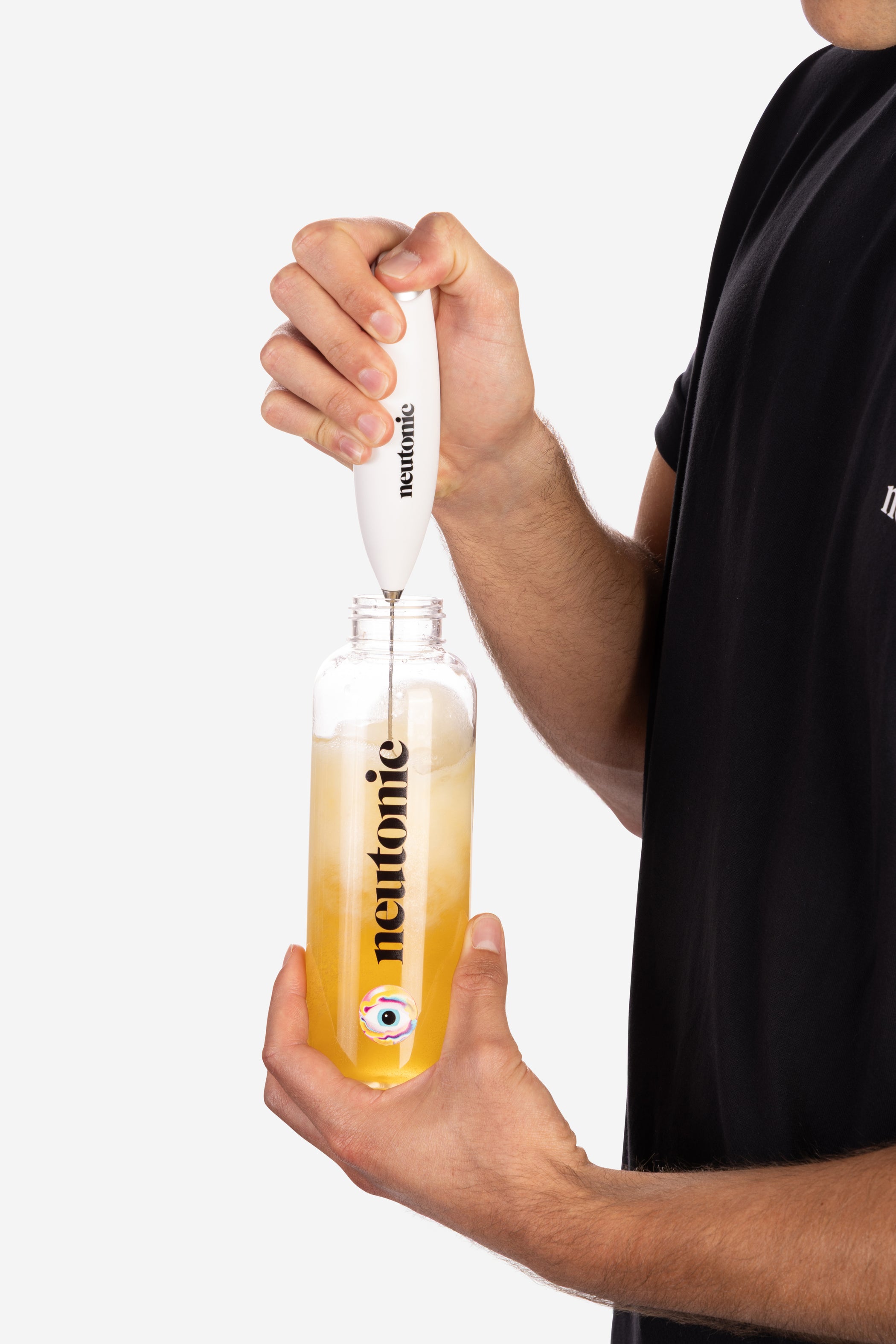 White handheld whisk mixing yellow nootropics drink in clear glass bottle with black lid. - Neutonic - Handheld Whisk