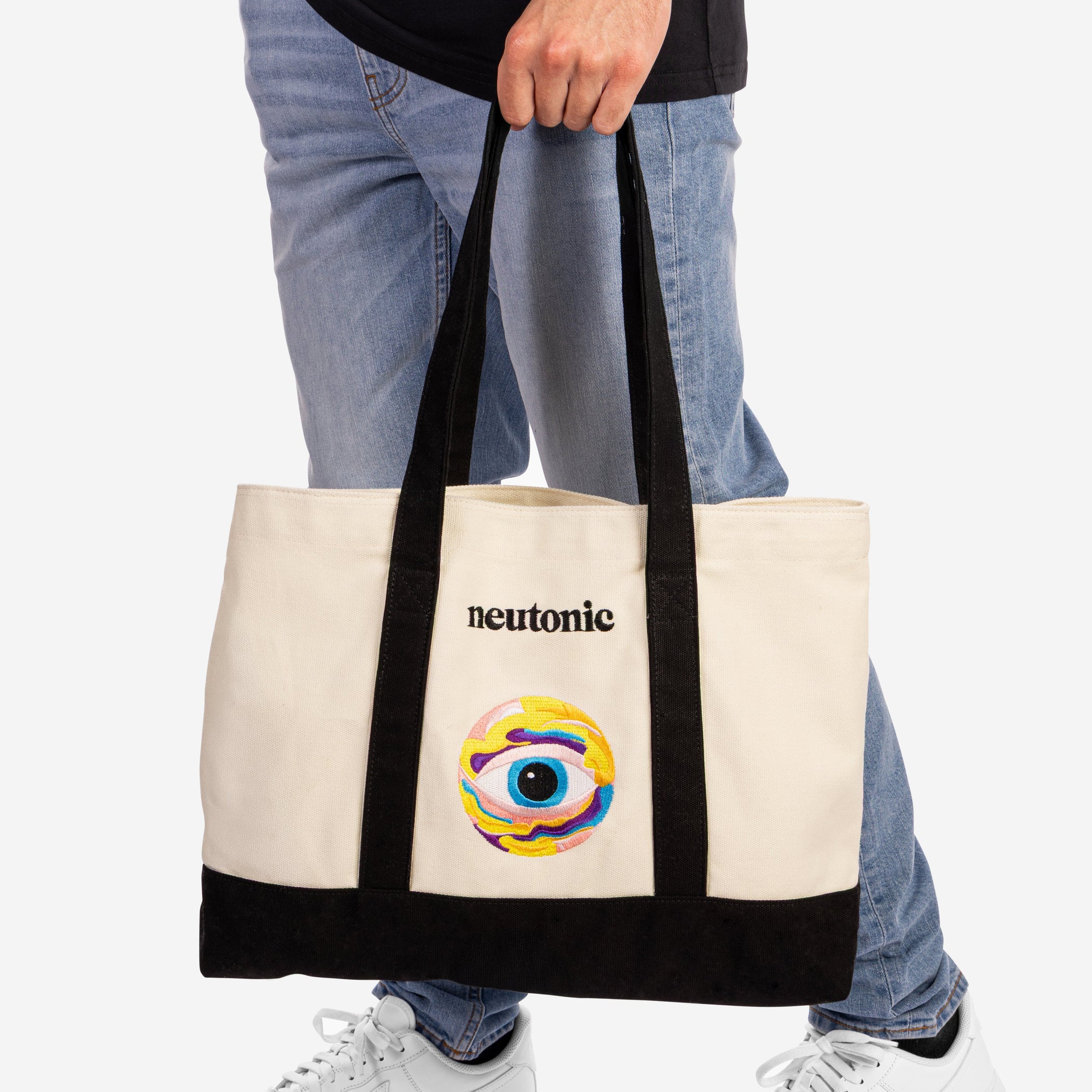 Canvas tote bag with black handles and base, featuring colorful nootropics-themed eye logo and "neutonic" text. - Neutonic - Tote Bag