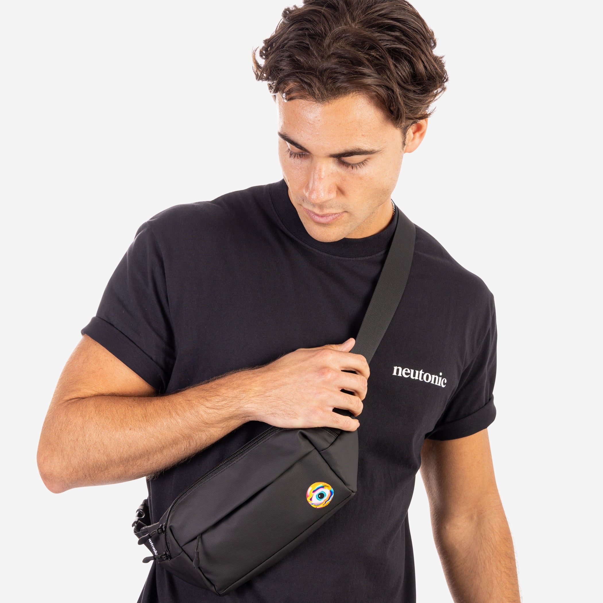 Black side bag with colorful circular logo worn across chest, paired with black nootropics t-shirt. - Neutonic - Side Bag