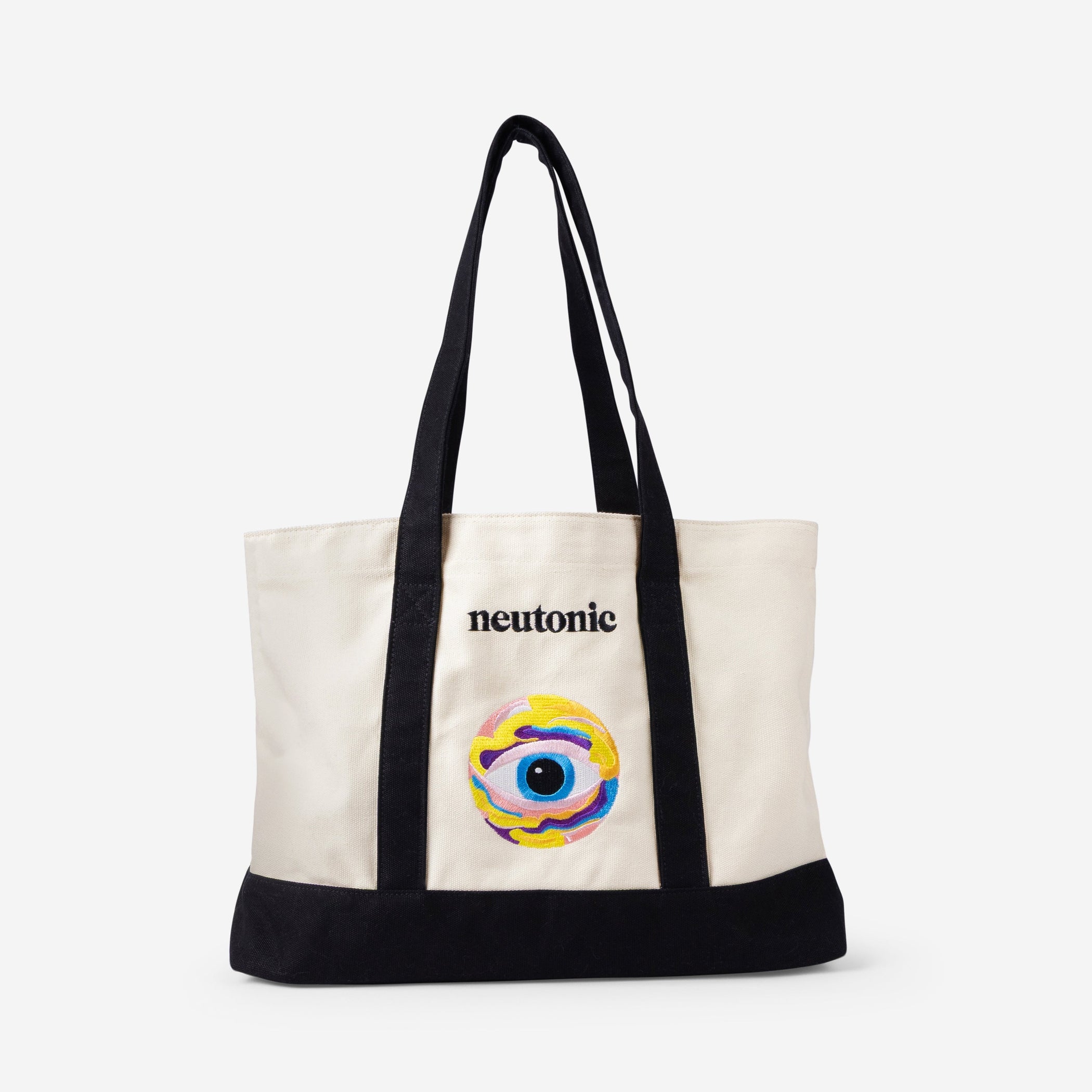 Cream canvas tote bag with black straps and base, featuring colorful nootropics eye design and "neutonic" text on front. - Neutonic - Tote Bag