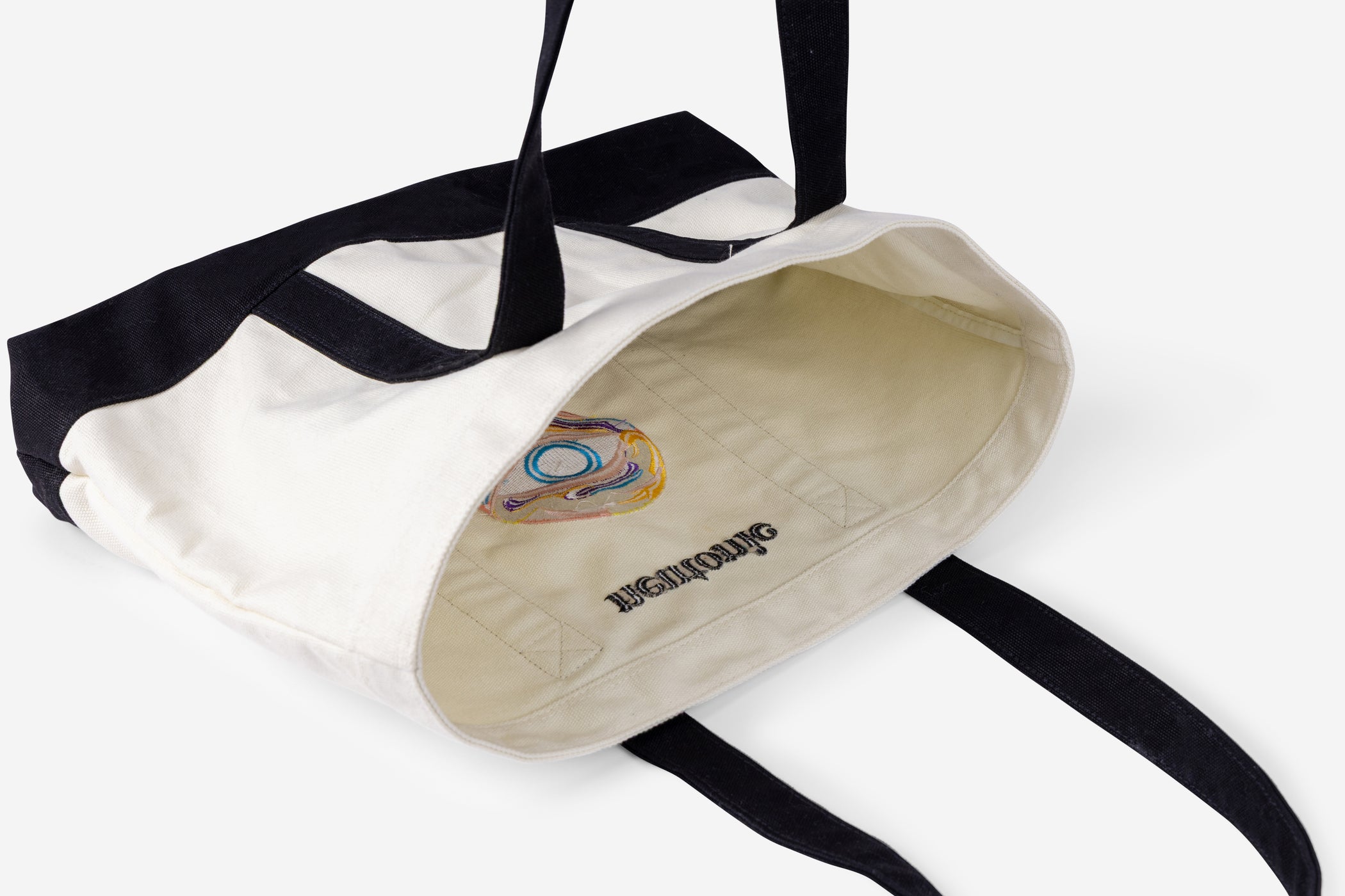 White canvas tote bag with black handles and nootropics logo inside lining. - Neutonic - Tote Bag