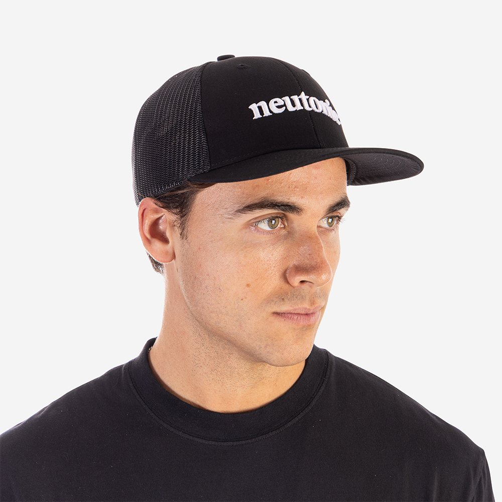 Black trucker cap with white "neutro" text, mesh back, worn by man, nootropics theme. - Neutonic - Trucker Cap