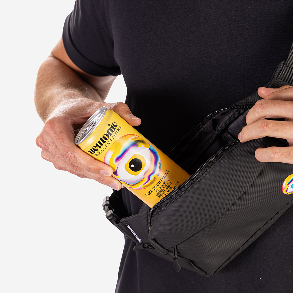 Black side bag with zip pocket holding a yellow nootropics energy drink can. - Neutonic - Side Bag